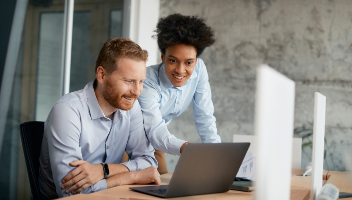 Man and woman at desk